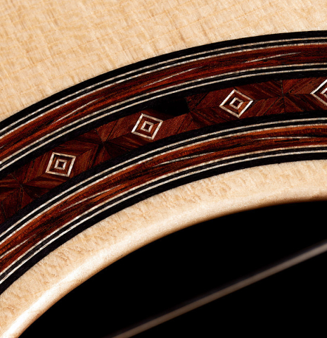 Closeup detail of the rosette of a 2024 Jochen Rothel classical guitar made with spruce top and CSA rosewood back and sides