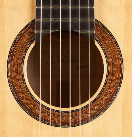 The rosette of a 2007 Jochen Rothel classical guitar made of spruce and maple