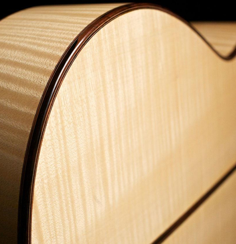 The back binding and purflings of a 2007 Jochen Rothel classical guitar made of spruce and maple