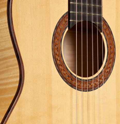 The soundboard and rosette of a 2007 Jochen Rothel classical guitar made of spruce and maple
