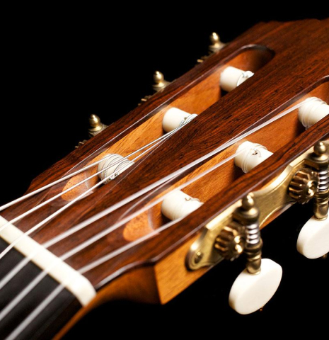 The headstock and tuning machines of a 2007 Jochen Rothel classical guitar made of spruce and maple