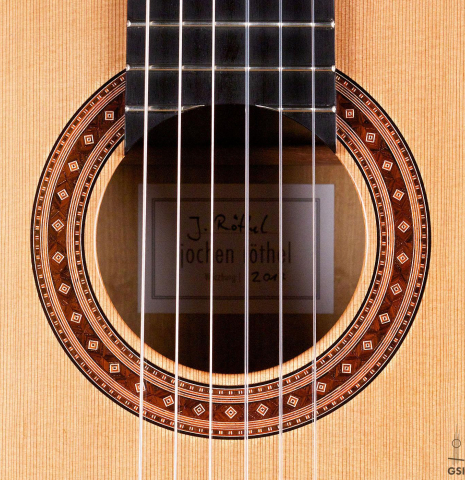The rosette of a 2017 Jochen Rothel classical guitar made with cedar and satinwood