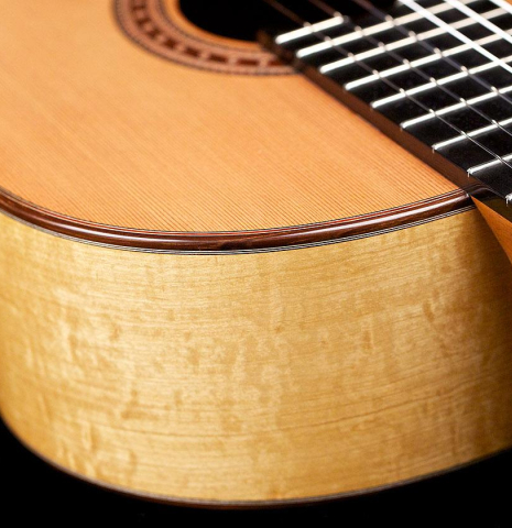 The soundboard and sides of a 2017 Jochen Rothel classical guitar made with cedar and satinwood