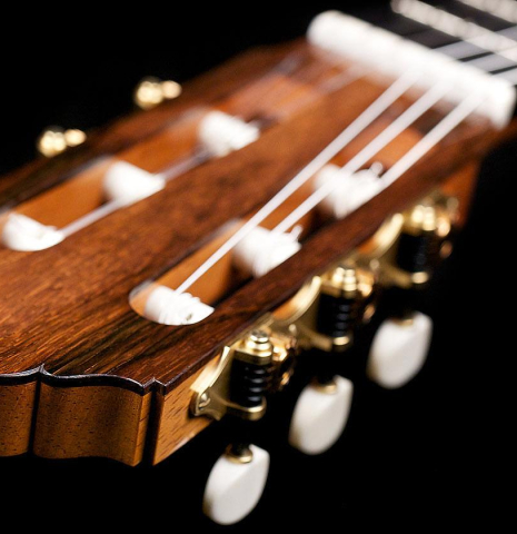 The headstock and tuners of a 2017 Jochen Rothel classical guitar made with cedar and satinwood