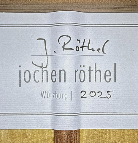 The label of a 2025 Jochen Rothel classical guitar made of cedar and satinwood