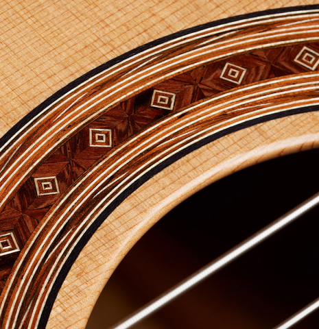 Detailed closeup of the rosette of a 2025 Jochen Rothel classical guitar made of cedar and satinwood