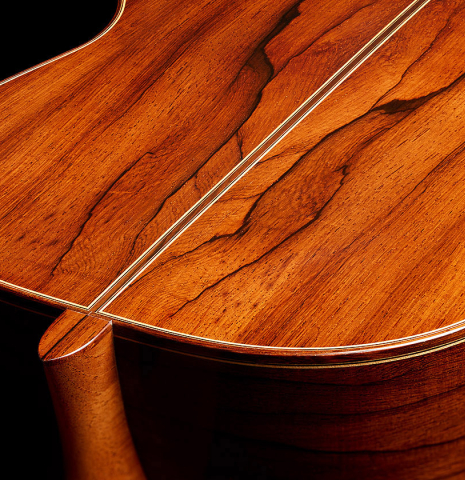 The heel, back binding and purflings of a 2010 Jochen Rothel classical guitar made of spruce and African rosewood