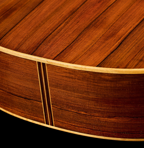 The back and sides at the foot of a 2026 Jochen Röthel classical guitar made of cedar and African rosewood
