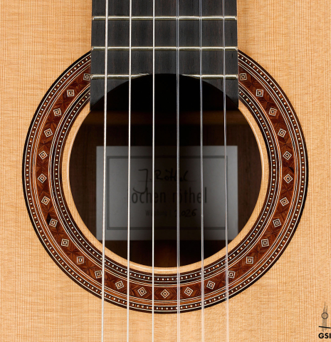 The rosette of a 2026 Jochen Röthel classical guitar made of cedar and African rosewood