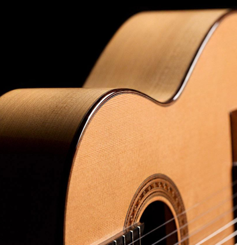 The soundboard, binding and side of a 2019 Jochen Rothel classical guitar made of cedar and cypress