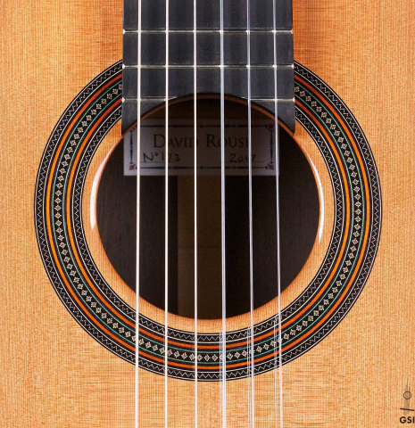 The rosette of a 2017 David Rouse classical guitar made of cedar and CSA rosewood
