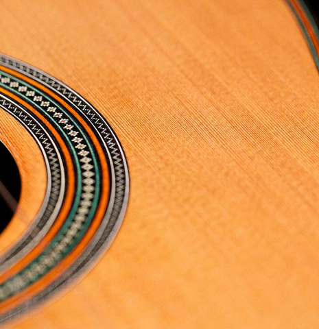 The top and rosette detail of a 2017 David Rouse classical guitar made of cedar and CSA rosewood