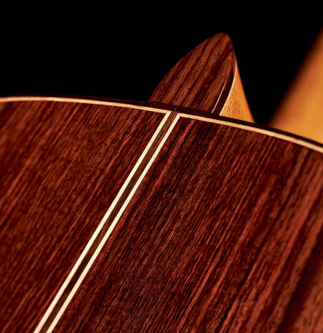 The back and heel of a 2022 German Vazquez Rubio "Solista" classical guitar made of spruce and Indian rosewood