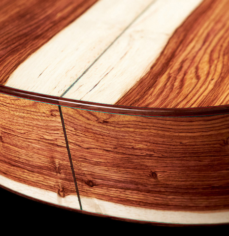 The lower bout of a 2023 German Vazquez Rubio &quot;Classic Estudio&quot; classical guitar made of cedar and palo escrito