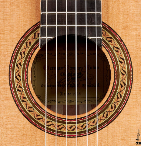 The rosette of a 2023 German Vazquez Rubio &quot;Classic Estudio&quot; classical guitar made of cedar and palo escrito