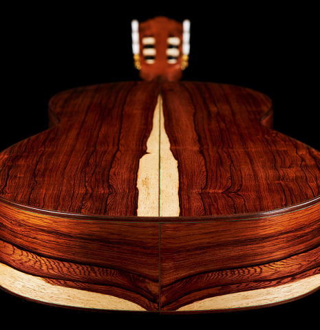 The back and sides at the foot of a 2024 German Vazquez Rubio "Classic Estudio" classical guitar made of cedar and palo escrito