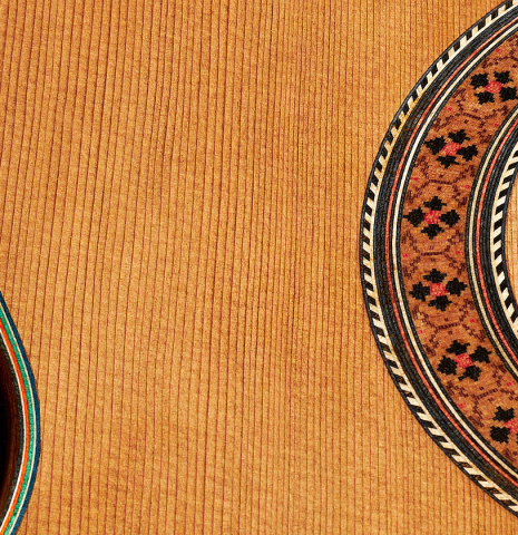 The top and rosette detail of a 2024 German Vazquez Rubio "Classic Estudio" classical guitar made of cedar and palo escrito