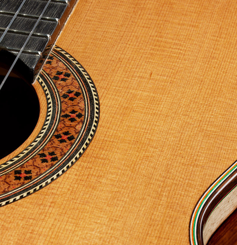 The top and rosette of a 2025 German Vazquez Rubio "Classic Estudio" classical guitar made of cedar and palo escrito