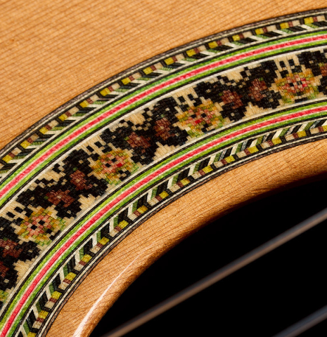 Closeup detail of the rosette of a 2025 German Vazquez Rubio "Classic Estudio" classical guitar made of cedar and palo escrito