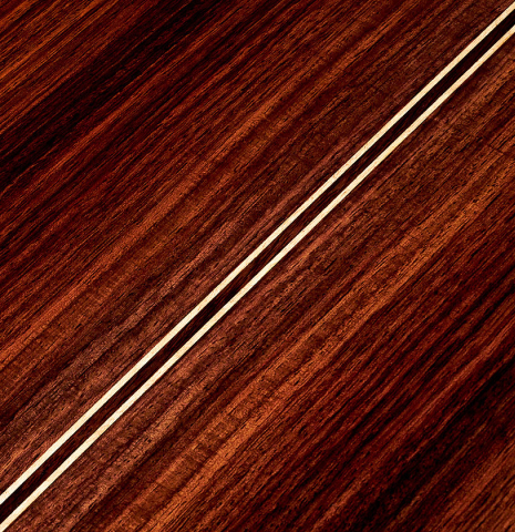 The back of a 2022 German Vazquez Rubio "Solista" classical guitar made with cedar and Indian rosewood The back of a 2022 German Vazquez Rubio "Solista" classical guitar made with cedar and Indian rosewood