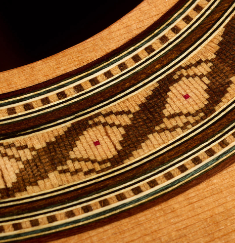 Detailed close-up of the rosette of a 2026 German Vazquez Rubio "Solista" classical guitar made of cedar and Indian rosewood