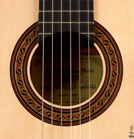 The rosette of a 2022 German Vazquez Rubio &quot;Classic Estudio&quot; classical guitar made of spruce and Palo Escrito.