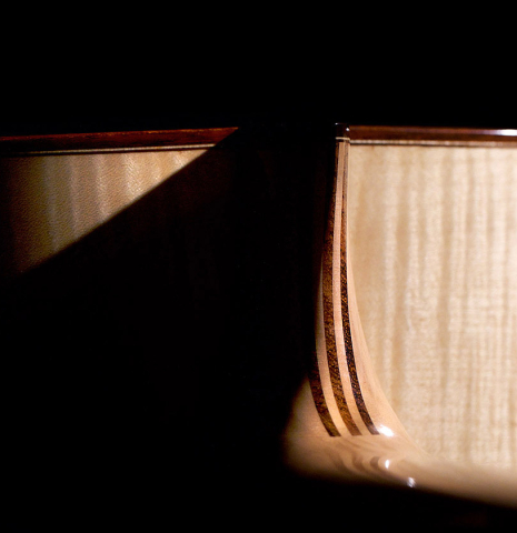 The heel of a 2021 German Vazquez Rubio "Concert 635" classical guitar made with spruce and maple