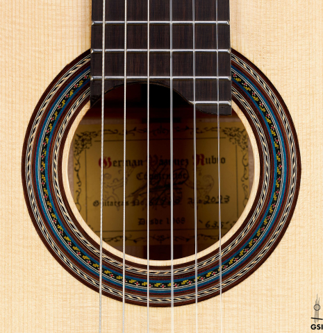 This is the rosette of a 2023 German Vazquez Rubio "Concert 635" classical guitar made with spruce top and maple back and sides