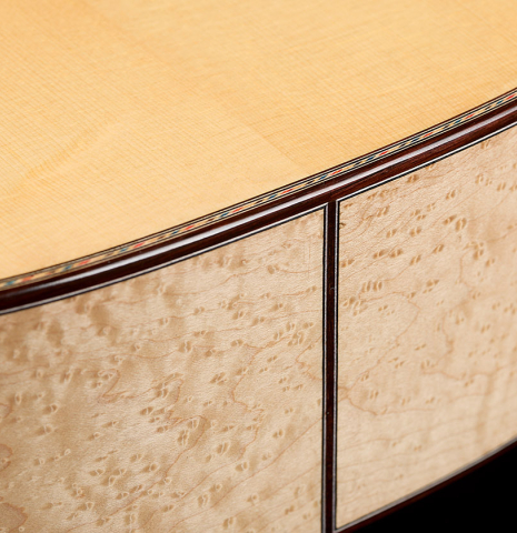 The top and sides at the foot of a 2026 German Vazquez Rubio "Concert 635" classical guitar made of spruce and maple