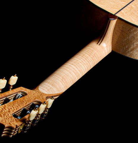 The flamed maple neck of a 2026 German Vazquez Rubio "Concert 635" classical guitar made of spruce and maple
