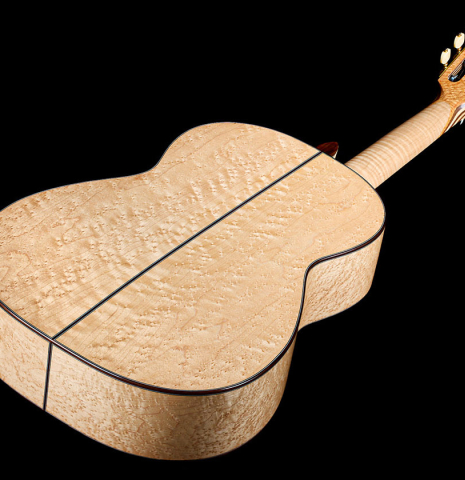 The birdseye maple back and sides of a 2026 German Vazquez Rubio "Concert 635" classical guitar made of spruce and maple