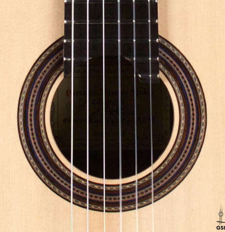 The rosette of a 2018 German Vazquez Rubio "Concert 635" classical guitar made with spruce and CSA rosewood.