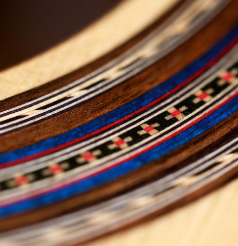 The rosette of a 2018 German Vazquez Rubio "Concert 635" classical guitar made with spruce and CSA rosewood.