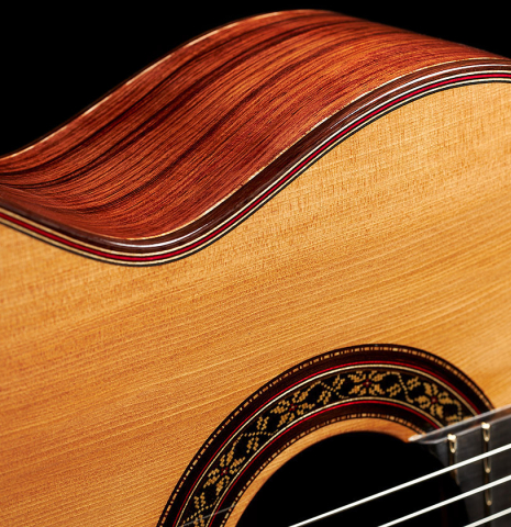 The top and rosette of a 2024 German Vazquez Rubio "Divina" classical guitar made of cedar and palo escrito