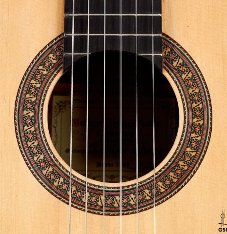 The rosette of a 2022 German Vazquez Rubio "Divina" classical guitar made with spruce and Palo Escrito
