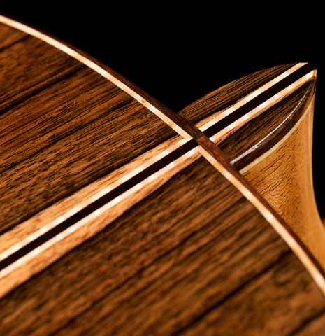 The heel of a 2021 German Vazquez Rubio "Concert 635" classical guitar made of spruce and ziricote