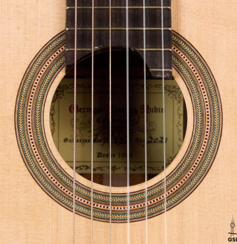 The rosette of a 2021 German Vazquez Rubio &quot;Hauser&quot; classical guitar made of spruce and cocobolo