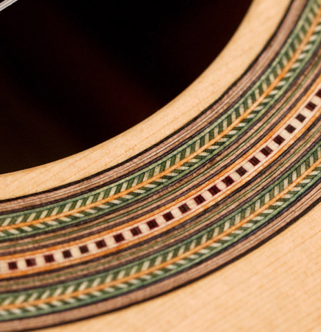 The rosette of a 2021 German Vazquez Rubio "Hauser" classical guitar made of spruce and cocobolo