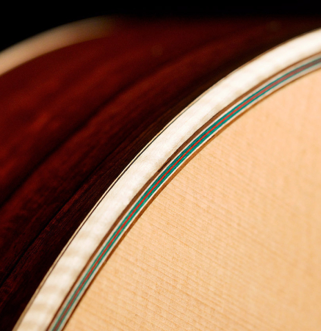 The binding of a 2021 German Vazquez Rubio &quot;Hauser&quot; classical guitar made of spruce and cocobolo