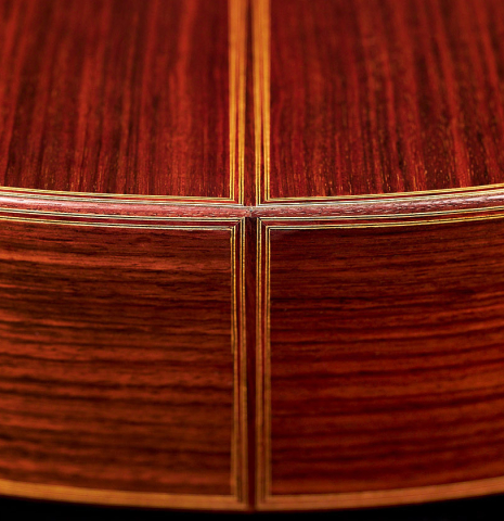 The back and sides of a 1969 David Rubio classical guitar made of spruce and Indian rosewood