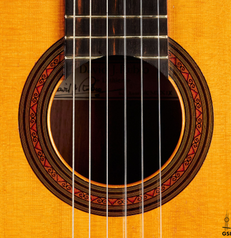 The rosette of a 1969 David Rubio classical guitar made of spruce and Indian rosewood