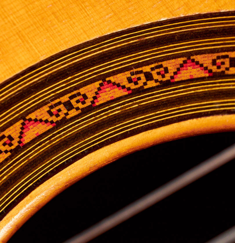 A close-up of the rosette of a 1969 David Rubio classical guitar made of spruce and Indian rosewood