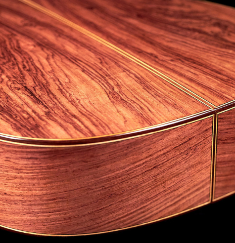 The back and sides of a 2022 German Vazquez Rubio "Divina" classical guitar made of cedar and kingswood