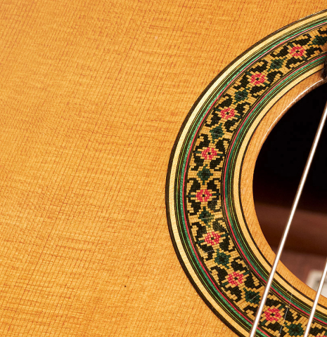 The rosette of a 1999 German Vazquez Rubio "640" classical guitar made with cedar and palo escrito