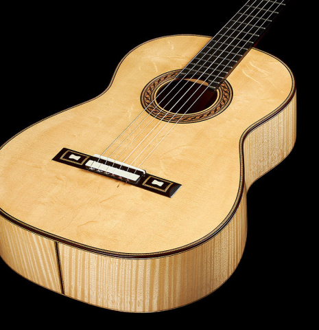 The top and sides of a 2012 German Vazquez Rubio "Torres" made of spruce and maple