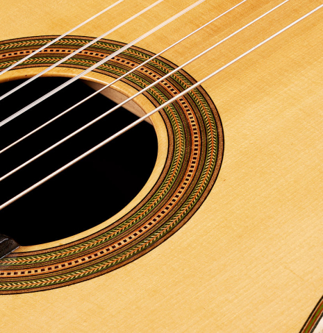 The soundboard of a 2024 German Vazquez Rubio "Hauser" classical guitar made of spruce and CSA rosewood