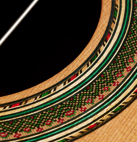 Closeup detail of the rosette of a 2025 German Vazquez Rubio "Solista 640 Lefty" classical guitar made of cedar and Indian rosewood
