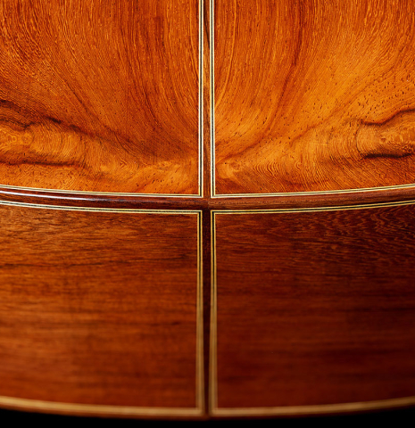 The back and sides at the foot of a 2024 German Vazquez Rubio "Custom Elite" classical guitar made of spruce and CSA rosewood