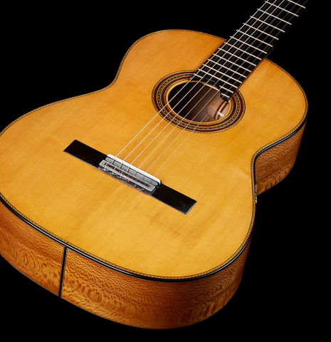 The soundboard of a 2025 German Vazquez Rubio "Solista" classical guitar made of cedar and Brazilian lacewood