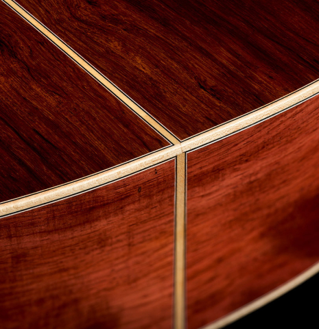 The back and sides at the foot of a 2026 German Vazquez Rubio "Hauser" classical guitar made of spruce and palo escrito